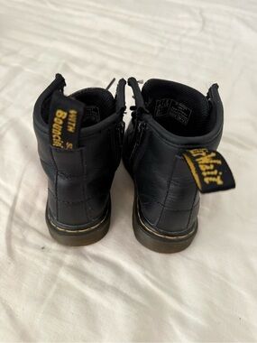 Dr. Martens Black Kids Ankle Boots with Yellow Heel Loop